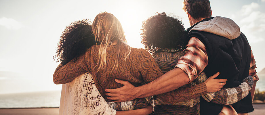 A group of friends embracing.