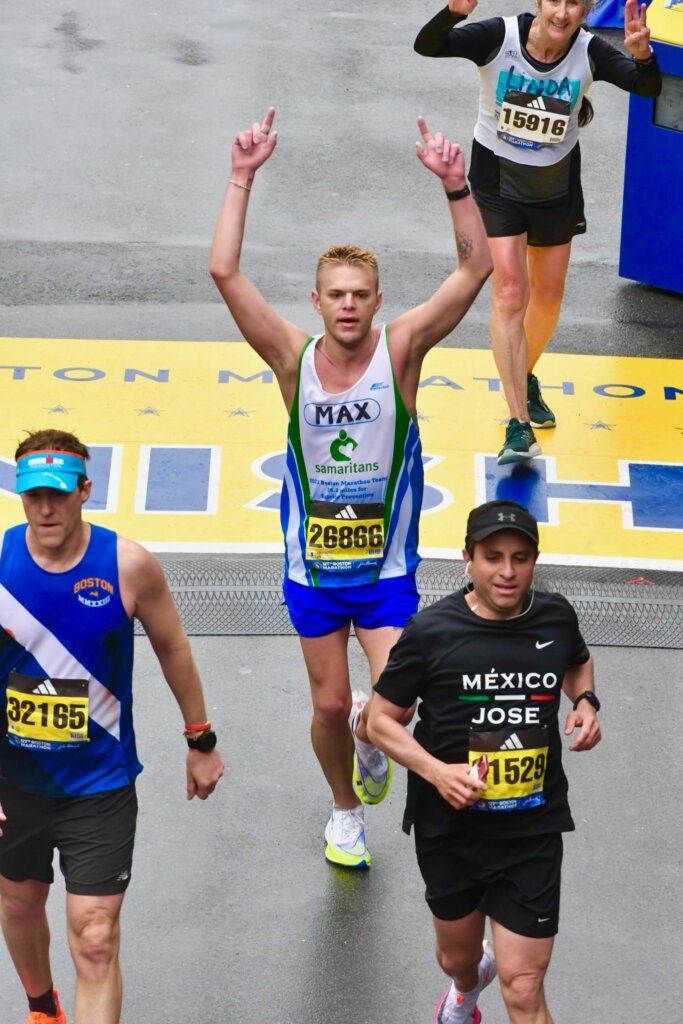 Boston Marathon runners cross the finish line
