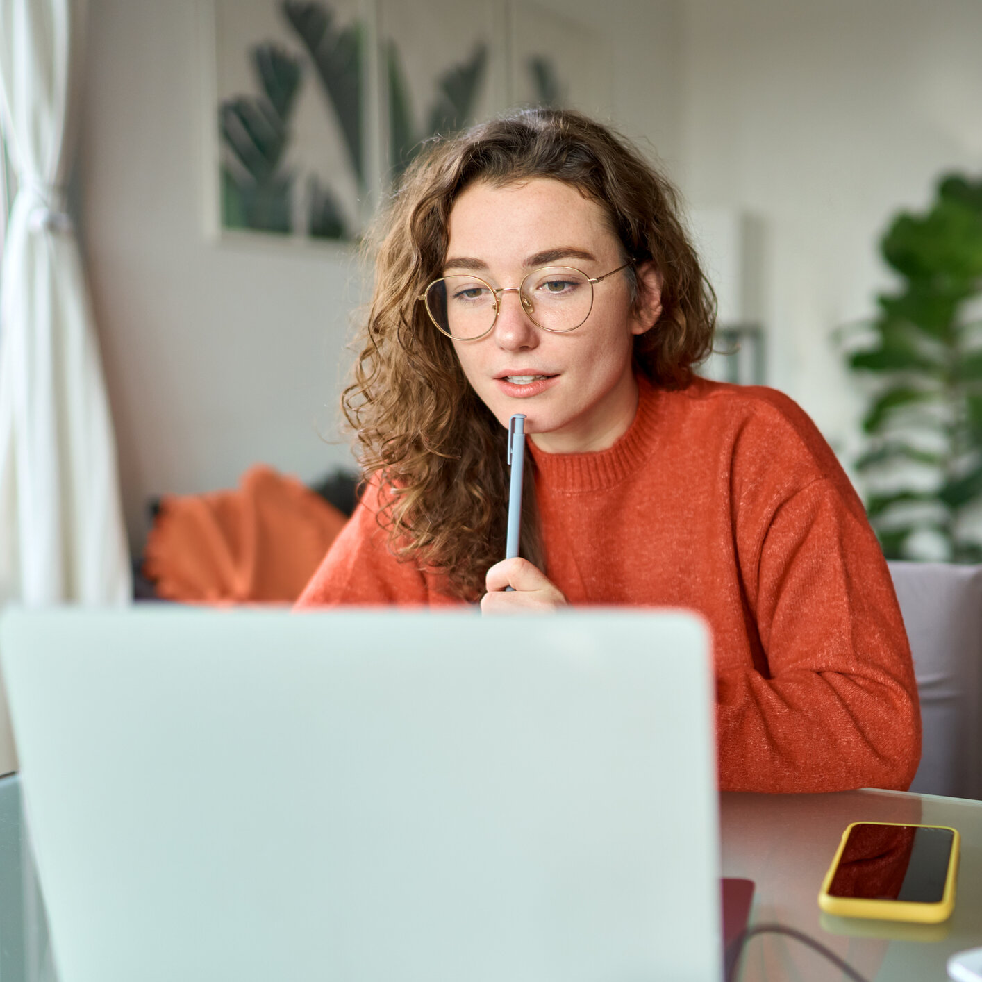 young woman sitting at laptop