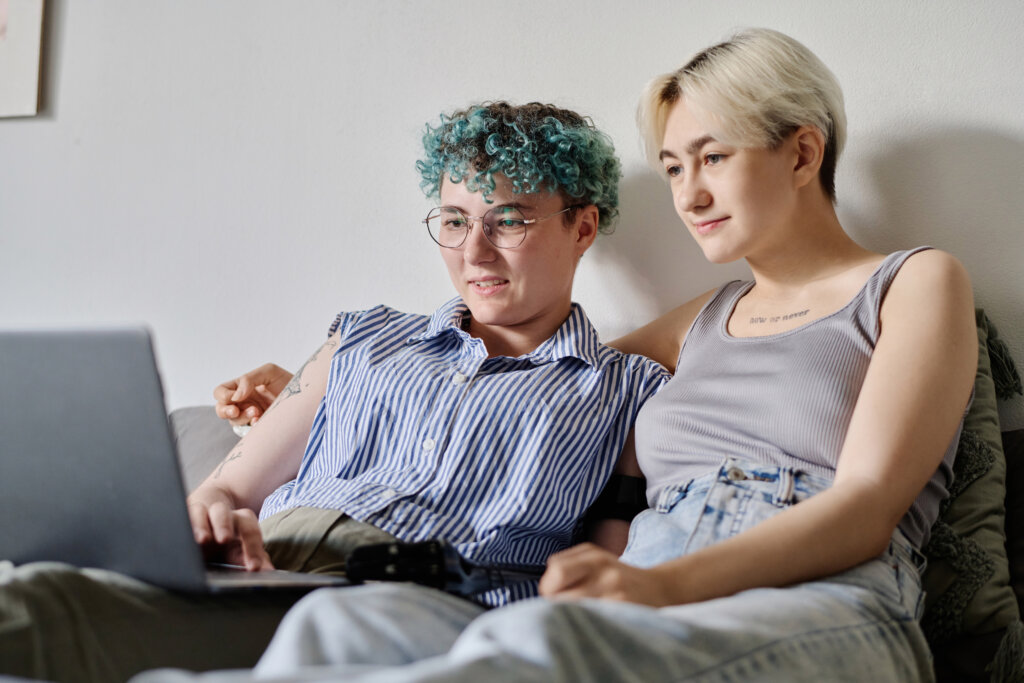 Two people looking at laptop