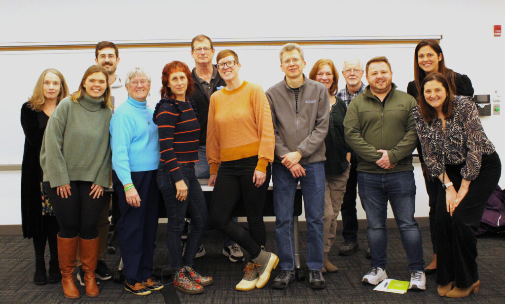 Michele (5th from the right), fellow grief support facilitators, and Samaritans staff gathered for a quarterly meeting in spring 2024.