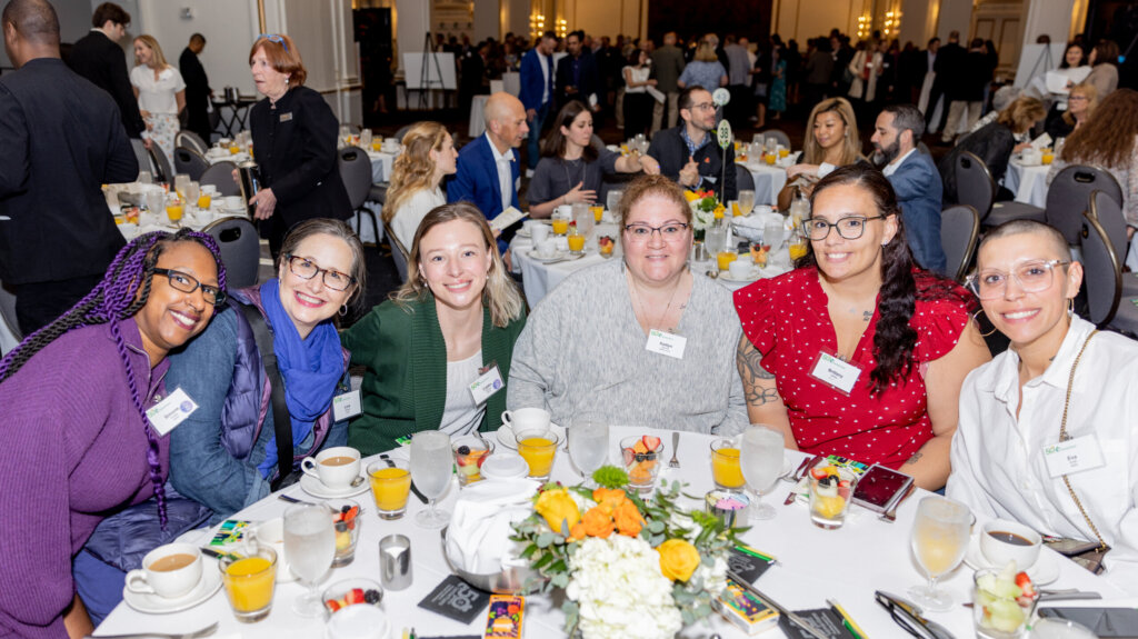 6 people sitting at a table for the 2024 Samaritans Breakfast for Hope