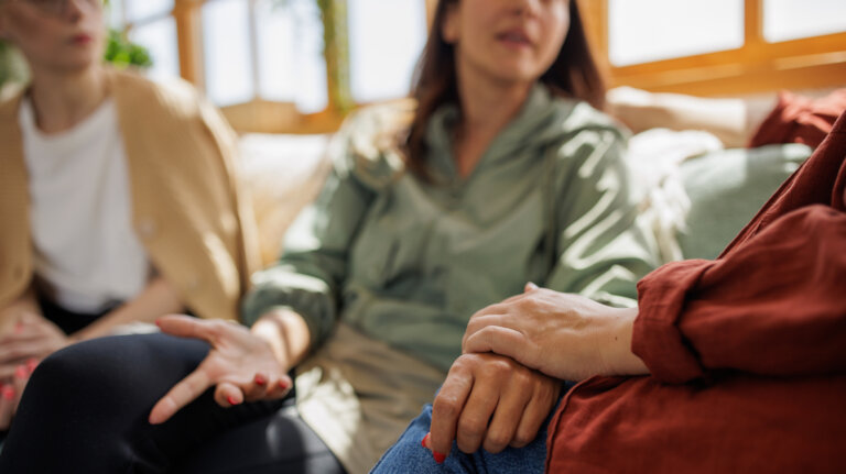 Small group of female friends supporting each other