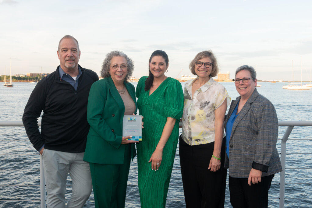 Samaritans President and CEO Kathleen C. Marchi poses with her Excellence Award in Leadership.