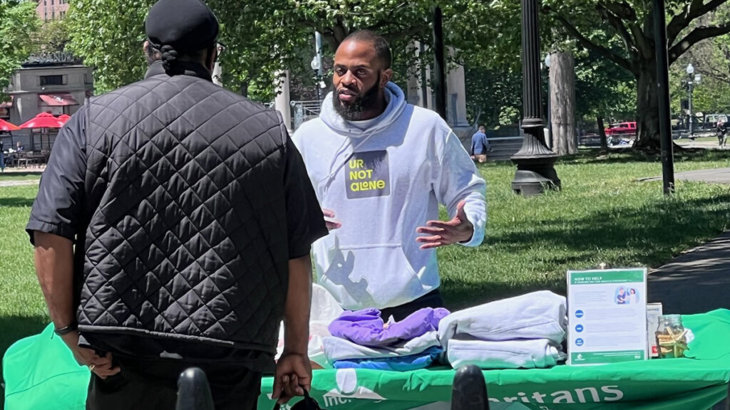 Samaritans Community Outreach and Partnership Manager Michael Davis tabling on Boston Common.