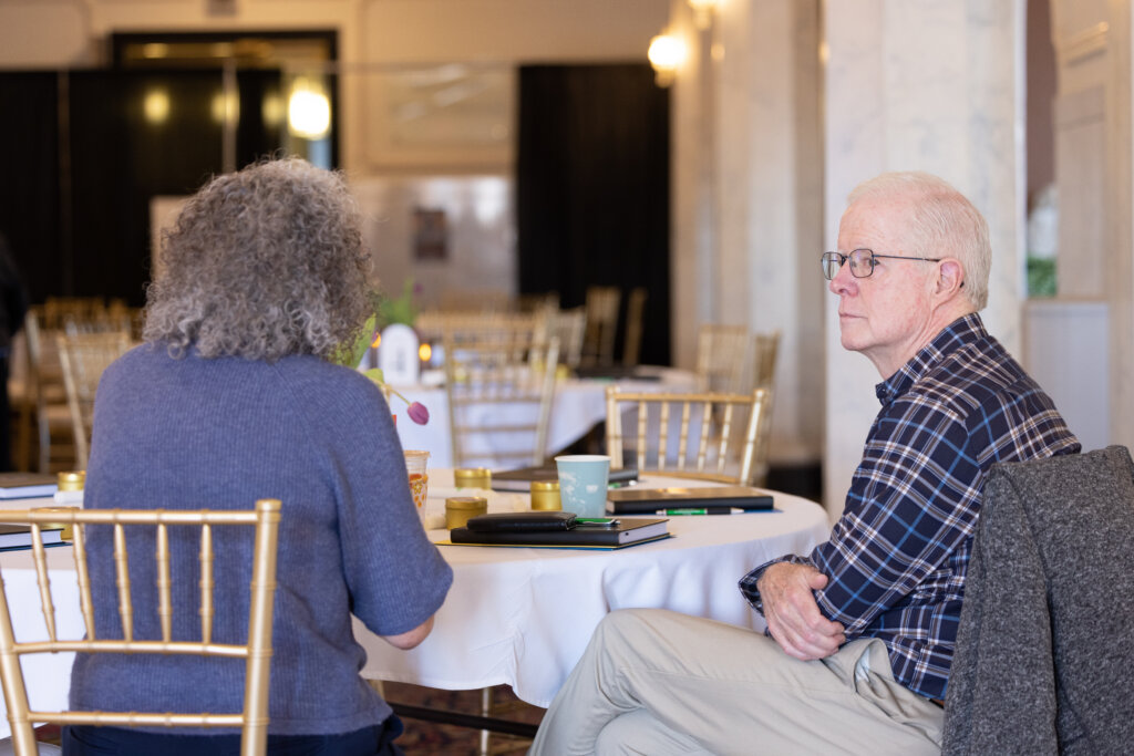 A women and a man speaking. 