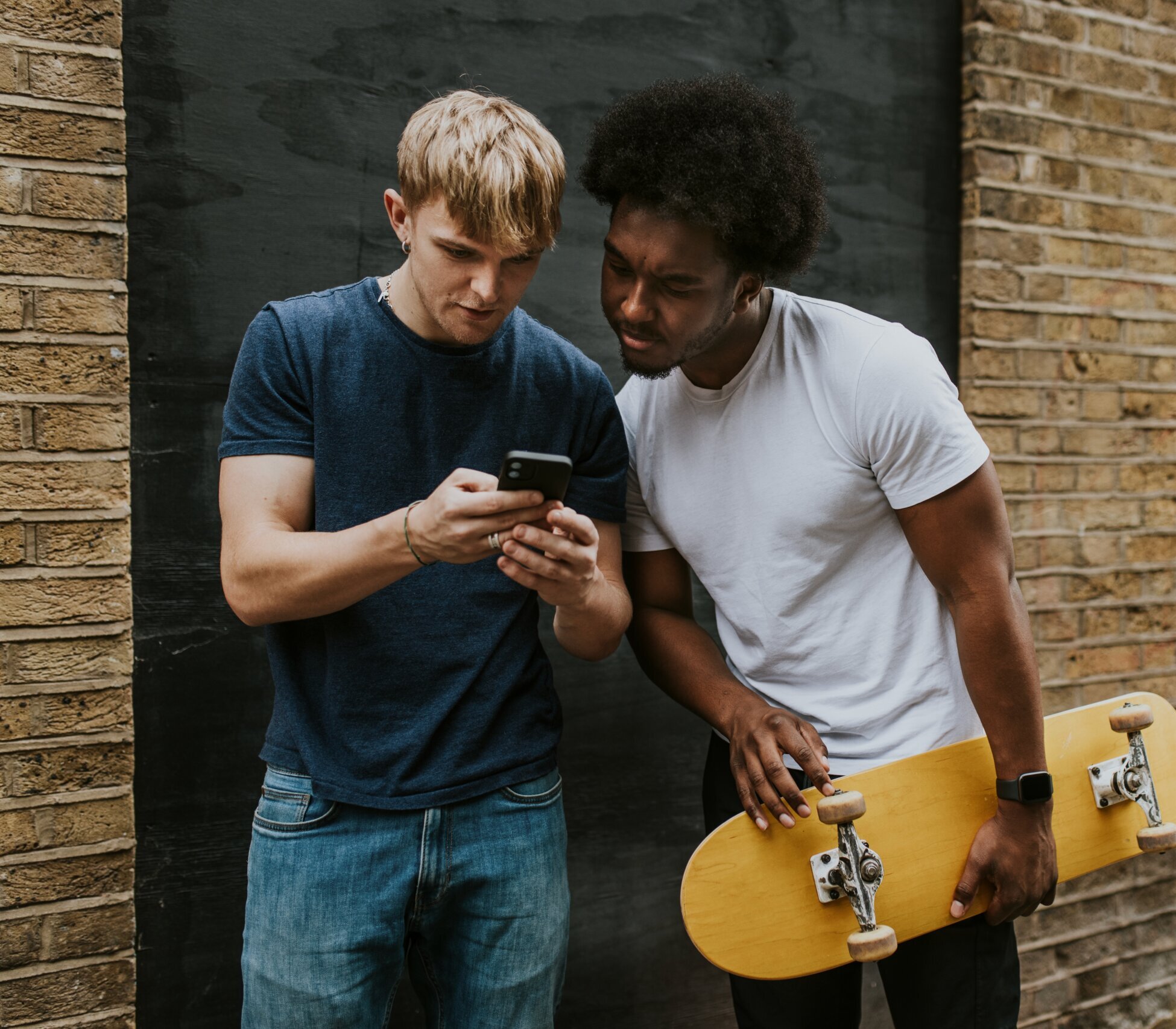 teen sitting outside texting