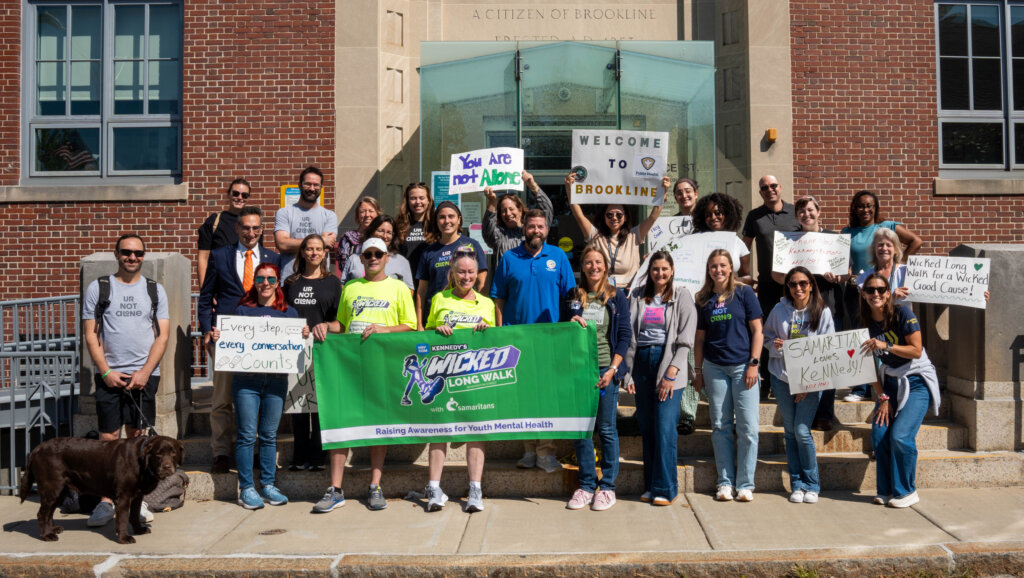 A group of Samaritans staff gather outside to cheer on a HopeRaiser. 