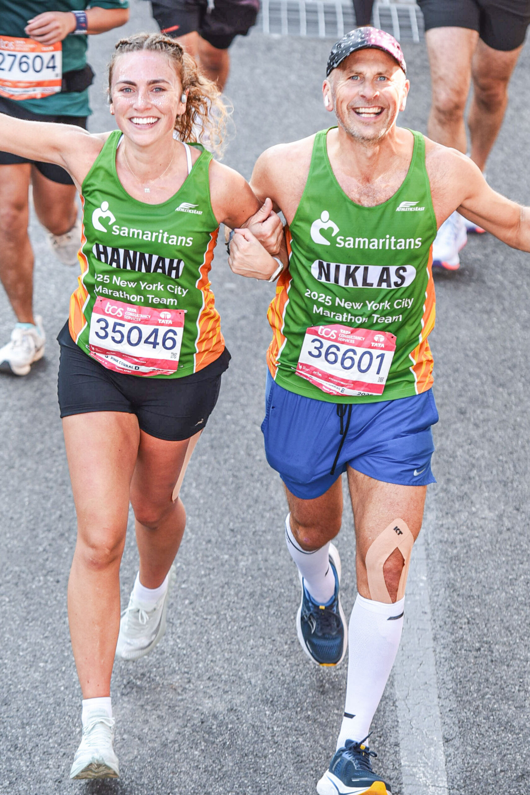Runners cross the finish line at the 2025 TCS New York City Marathon.